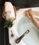 Photo of female feet in bathtub