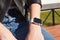 Photo of female hands touching screen generic design smart watch