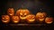 Photo of a festive display of carved pumpkins on a tabletop