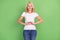 Photo of flirty blond senior lady show heart wear white t-shirt isolated on pastel green color background
