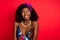 Photo of flirty dreamy curly dark skin woman dressed pinup clothes smiling looking empty space  red color