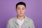 Photo of focused chinese worker manager employee look camera isolated violet color background