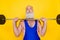 Photo of focused determined aged man hands hold barbell push press isolated on yellow color background