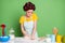 Photo of focused girl knead fresh pie cake dough table prepare home made dish wear yellow dotted t-shirt hair rollers