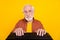 Photo of focused retired old man sit keyboard look webcamera wear specs brown shirt isolated yellow color background