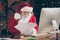 Photo of focused santa claus christmas worker want prepare gift present x-mas night midnight read wish list letters