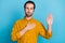 Photo of focused successful guy palm chest raise hand pledge vow wear yellow shirt isolated blue color background