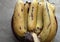 photo focusing on bananas on a plate on a white background