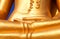 Photo fragment of a beautiful statue of a golden Buddha