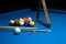 Photo fragment of the blue pool billiard game with cue. Pool billiard game. Billiard sport concept.play cue and