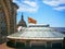 Photo of fragment Dome and official flag of Catalonia on the roof of Famous National Art Museum in Barcelona,Spain