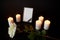Photo frame with black ribbon, flower and candles