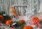 Photo frame with an elegant snowman , bright tangerines and Christmas tinsel, side view