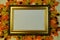 Photo frame, inscriptions, plaques, design, with gold ornament on the background of autumn maple leaves.