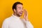 Photo of friendly announcer guy palm open mouth tell exciting news wear white sweater isolated yellow color background