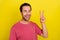 Photo of friendly positive guy show v-sign peaceful symbol wear pink t-shirt isolated yellow color background