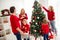 Photo of full big family five people gathering three small kids decorate x-mas tree dad hold box give ball mom son wear