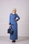 Photo Full-length of a beautiful young woman in a modern Muslim clothing