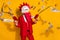 Photo of funky authentic guy hold money gun shoot cash wear rooster mask red suit isolated yellow color background