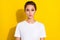 Photo of funky brown short hairdo young lady blow kiss wear white t-shirt isolated on yellow color background