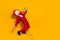 Photo of funky carefree incognito guy hold mic sing song wear rooster mask red tux isolated yellow color background