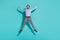 Photo of funky careless executive crazy man jump enjoy flight wear purple shirt pants shoes isolated teal color