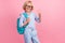 Photo of funky cool school boy wear blue shirt glasses backpack smiling showing v-sign isolated pink color background