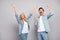 Photo of funky couple hand up yell wear jeans shirt isolated on grey color background