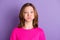 Photo of funky cute cheerful teenage girl hold breath cheeks funny face  on violet color background