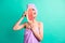 Photo of funky cute girl slice watermelon hide half face wear violet towel turban isolated turquoise color background