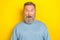 Photo of funky excited retired guy wear blue sweater big eyes open mouth isolated yellow color background