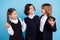 Photo of funky excited schoolkids formalwear smiling embracing hugging talking isolated blue color background