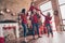 Photo of funky family father piggyback hold daughter hold hands tradition in decorated x-mas home indoors