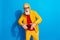 Photo of funky funny cool mature man in glasses dancing wear yellow tracksuit isolated on blue color background