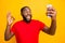 Photo of funky funny model black man taking selfie wearing red t-shirt showing ok okay symbol while isolated with yellow