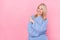 Photo of funky senior blond lady look promo wear blue sweater isolated on pink color background