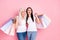 Photo of funny aged and young two ladies relatives hold many store packs go shopping together rejoicing wear white t