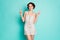 Photo of funny cheerful lady good mood showing v-sign symbols hands say hello friends wear casual summer white dotted