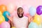 Photo of funny dark skin guy unexpected surprise decorations easter party festive mood raise hands wear sweater fluffy