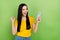 Photo of funny delighted girl raise fist celebrate follow comment read post isolated on green color background