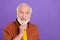 Photo of funny elder man look promo wearing brown shirt isolated over vivid violet color background