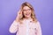 Photo of funny excited school girl dressed pink clothes arms glasses smiling looking empty space isolated purple color
