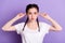 Photo of funny foolish young woman make funky face hold ears lips pouted isolated on purple color background