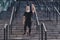 Photo of funny friendly retired man black sportswear standing stairs waving arm inviting you training outside urban city