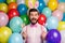 Photo of funny guy colorful decorations easter party festive mood hold eggs on sticks wear pink shirt bow tie suspenders