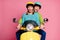 Photo of funny lady guy couple driving sitting big speed vintage yellow moped spend vacation together open mouth wear
