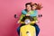 Photo of funny lady guy people couple in love driving sitting vintage yellow moped visit europe countries enjoy vacation