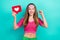 Photo of funny lucky school girl dressed pink crop top rising fist holding heart feedback  teal color background