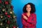 Photo of funny millennial brunette lady point tree wear red sleepwear isolated on blue color background