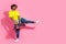 Photo of funny nice man wear stylish clothes music dance break dance look empty space isolated on pink color background